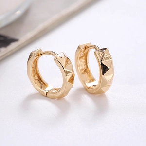 Minimalist geometric gold hoop earrings with 3D textured pyramid pattern design