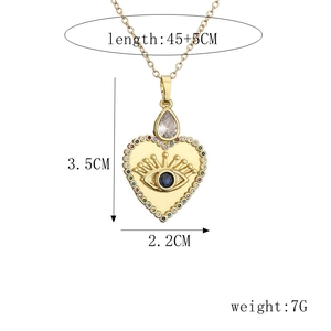 Detail view of heart evil eye pendant necklace with measurements 45+5cm and 3.5x2.2cm size