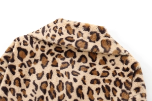 Close-up of the plush faux fur collar on this leopard print coat for a detailed texture view