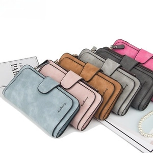 Close-up of multi-slot accordion card holder in various pastel matte colors