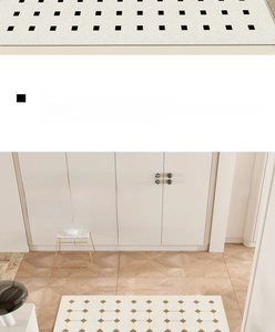 Detailed texture of warm white PVC doormat with minimalist black geometric stone patterns