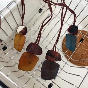 Bohemian irregular geometric resin pendant necklaces in amber and marble textures