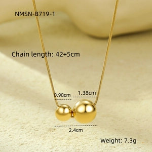 Detail of gold snake chain with polished hollow spherical pendants and measurements