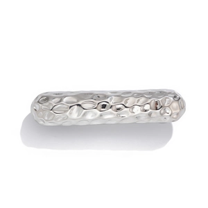 Detail of silver metallic hairpin with irregular double-layer curved hammered texture