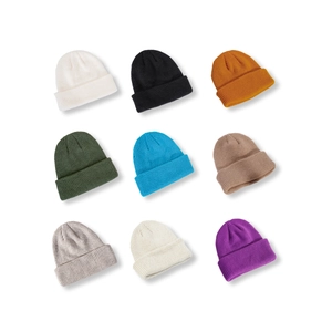 Set of nine colorful ribbed knit beanies for men and women with classic folded cuff style