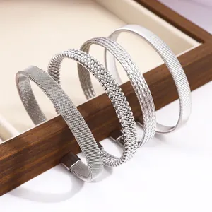 Set of four silver stainless steel braided open bangles with various textures for women