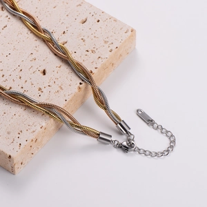 Three-tone woven stainless steel snake chain necklace in silver, gold, and rose gold