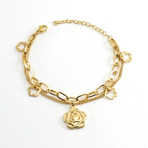 Double-layered 18k gold stainless steel bracelet featuring hollow flower pendants