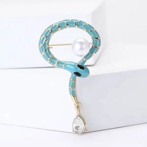 Blue enamel snake brooch with white pearl and teardrop crystal pendant on gold metal