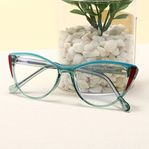 Cat-eye blue light blocking glasses with teal frames and vintage retro design