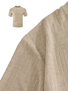 Detailed macro view showing the soft waffle texture and fabric weave of the men's polo shirt