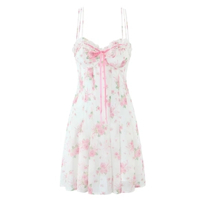 Close-up of floral mini dress with pink ribbon bow and delicate ruffle neckline detail