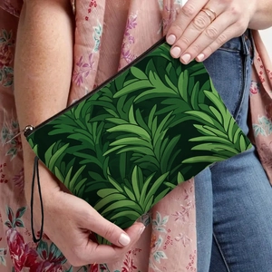 Tropical green leaf print cosmetic bag with secure zipper and wristlet strap