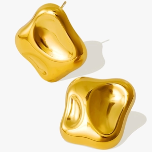 Macro view of gold 304 stainless steel earrings with irregular geometric shapes