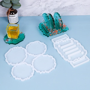 Macro view of silicone molds for irregular coasters and holder with finished resin crafts