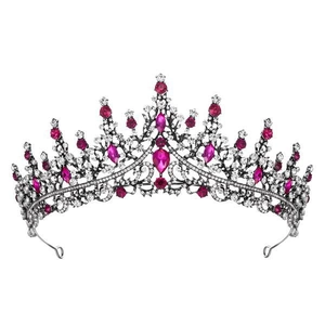 Detailed view of vintage princess crown with rose red and clear crystal rhinestones