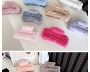 Close-up of assorted plush hair claws in various colors for elegant hairstyling