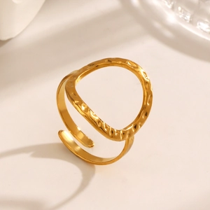 Golden open ring with hollow round design and hammered texture for a modern vintage look