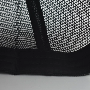 Detailed close-up of breathable black mesh back and reinforced stitching on a baseball cap