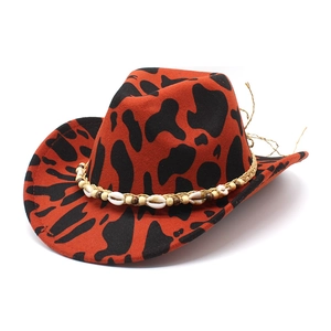 Red and black cow print fedora with bohemian shell and wood bead woven decoration