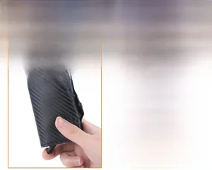 Detail view of the carbon fiber pattern and automatic pop-up mechanism on RFID card holder