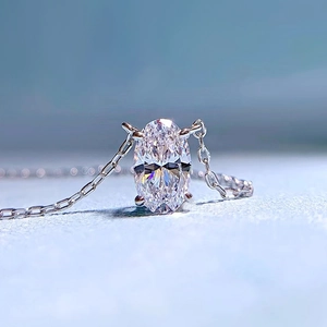 Macro detail of oval cut sparkling carbon diamond pendant on S925 silver chain necklace