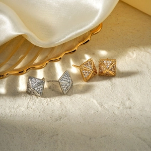 Elegant gold and silver square pyramid stud earrings with pavé cubic zirconia