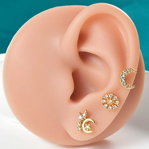 Three-piece gold plated stainless steel ear studs with moon, flower and butterfly design