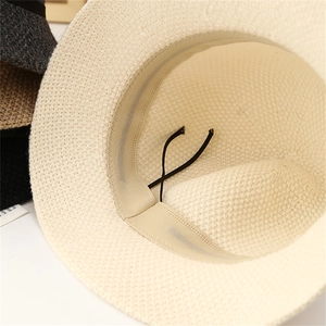 Detail view of knitted sun hat interior featuring adjustable inner band and sweatband