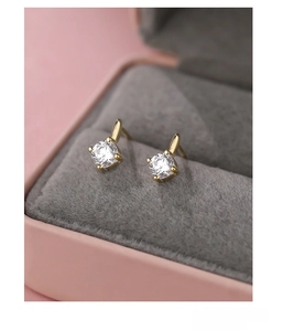 Detailed macro view of S999 sterling silver stud earrings with clear zircon stones