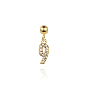 Detailed macro shot of a gold number 9 pendant featuring sparkling pave-set cubic zirconia