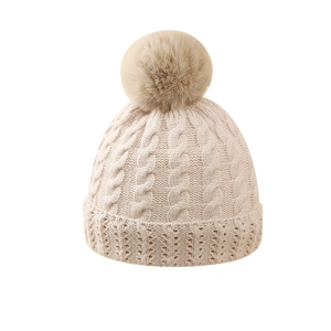 Winter cable knit baby beanie with faux fur pompom and warm ribbed cuff in beige