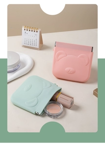 Pink and mint green silicone storage pouches with bear embossment and metal squeeze closure