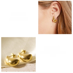 Detailed close-up of 18k gold plated bean stud earrings and model showing metallic luster