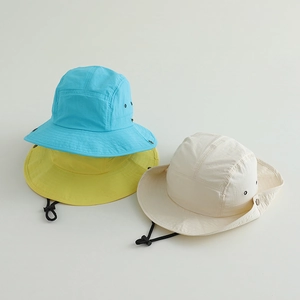 Detail of quick-dry kids sun hats with breathable eyelets and adjustable chin straps
