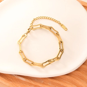 Adjustable 18k gold plated stainless steel chunky chain bracelet on a ceramic tray