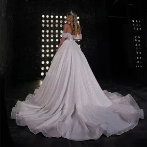 Sparkling off-the-shoulder bridal gown with luxury sequins and a dramatic long train