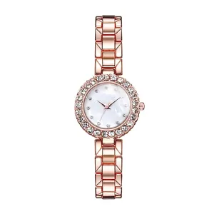 Detailed macro view of rose gold watch with rhinestone bezel and mother of pearl dial