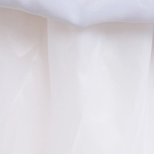 Close-up of lightweight white tulle mesh and smooth blue satin fabric for girls costume