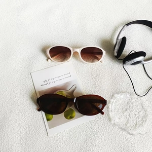 Retro oval sunglasses in cream and tortoiseshell frames with gradient brown lenses
