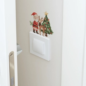 Detailed view of hand-painted Santa, reindeer, and tree wall decals around a light switch