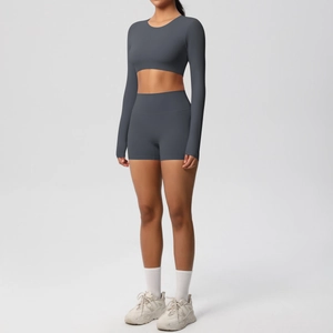 Front view of grey two-piece yoga set with long sleeve crop top and high waist shorts