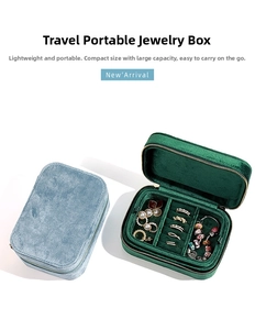 Detail view of velvet travel jewelry case showing ring slots and earring organizer