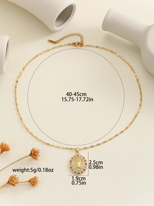 Detailed view of Virgin Mary pendant with colorful cubic zirconia on a gold chain
