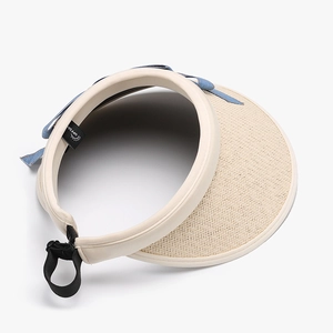 Foldable women's sun visor hat with UPF 50+ protection and a blue denim bow detail