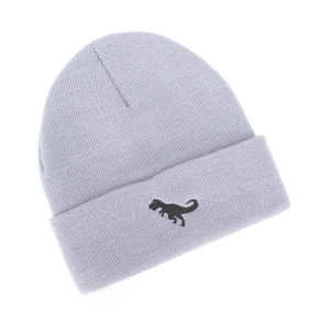 Detailed close-up of grey knitted beanie with embroidered black dinosaur on the cuff