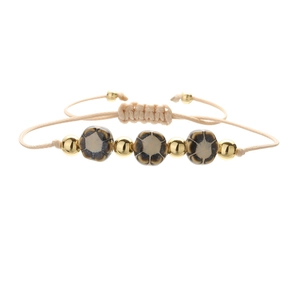 Handmade woven ceramic flower bracelet with adjustable beige cord and golden beads