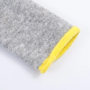 Women's knit cardigan featuring grey and yellow contrast colors and a thick wool texture