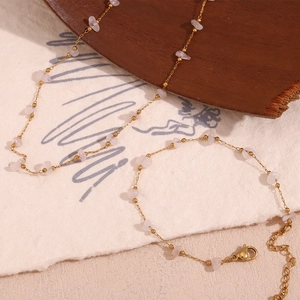 Close-up of pink quartz stone jewelry set with 18K gold plated stainless steel chain
