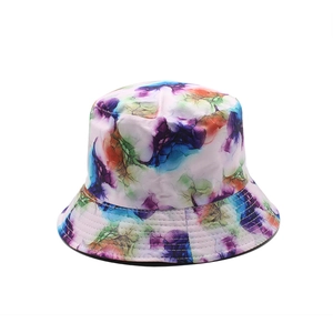 Fashionable reversible bucket hat featuring abstract colorful watercolor print and sun protection
